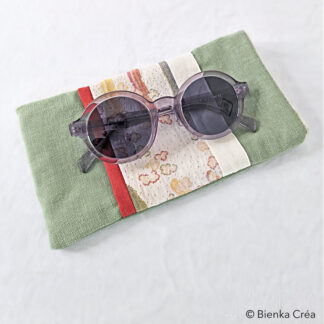 Étui-pochette doublé vert amande et orange à motifs