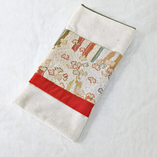 Étui-pochette blanc crème à motifs orangés
